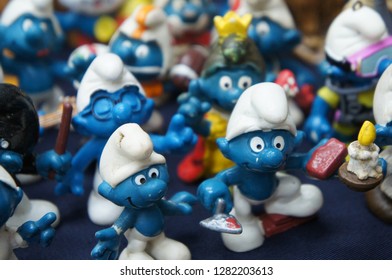 KUALA LUMPUR, MALAYSIA -DECEMBER 9, 2018:  Selective Focused Of Fictional Cartoon Action Figure Smurfs In Miniature Model Displayed For The Public On A Desk. 