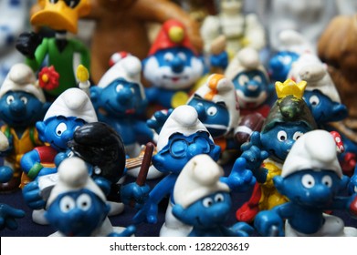 KUALA LUMPUR, MALAYSIA -DECEMBER 9, 2018:  Selective Focused Of Fictional Cartoon Action Figure Smurfs In Miniature Model Displayed For The Public On A Desk. 