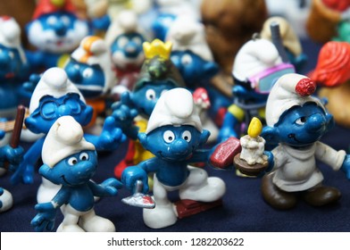 KUALA LUMPUR, MALAYSIA -DECEMBER 9, 2018:  Selective Focused Of Fictional Cartoon Action Figure Smurfs In Miniature Model Displayed For The Public On A Desk. 