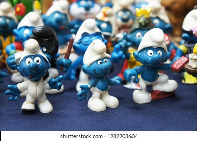 KUALA LUMPUR, MALAYSIA -DECEMBER 9, 2018:  Selective Focused Of Fictional Cartoon Action Figure Smurfs In Miniature Model Displayed For The Public On A Desk. 