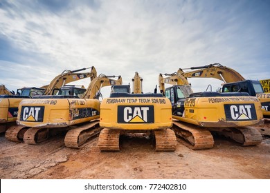 Kuala Lumpur, Malaysia - December 9, 2017: Modern hydraulic excavator on a field work site where an excavation works is performed in Kuala Lumpur, Malaysia.