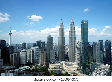 Kuala Lumpur, Malaysia - Dis 16,2019 - Petronas Towers and KLCC.Petronas Towers is a high-rise building in Kuala Lumpur, Malaysia.This tower was built in 1998.height is 452 m. - Shutterstock ID 1589646070