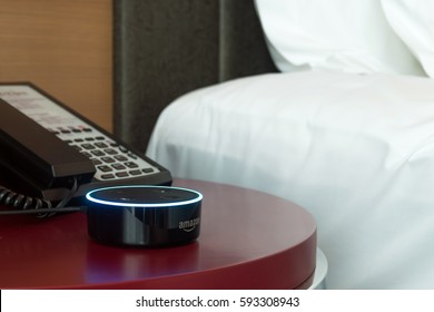 Kuala Lumpur, Malaysia - Fabruary 24 : Selective focus on Amazon Echo dot version 2, the voice recognition streaming device from Amazon on table in bedroom . February 24 2017 in Kuala Lumpur, Malaysia