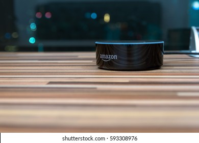 Kuala Lumpur, Malaysia - Fabruary 24 : Selective focus on Amazon Echo dot version 2, the voice recognition streaming device from Amazon on table. February 24 2017 in Kuala Lumpur, Malaysia