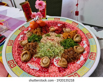 Kuala Lumpur, Malaysia - Feb 17 2021: Yusheng, yee sang or yuu sahng, or Prosperity Toss, also known as lo sahng is a Cantonese-style raw fish salad. It usually consists of strips of raw fish