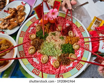 Kuala Lumpur, Malaysia - Feb 17 2021: Yusheng, yee sang or yuu sahng, or Prosperity Toss, also known as lo sahng is a Cantonese-style raw fish salad. It usually consists of strips of raw fish