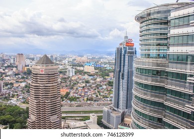 KUALA LUMPUR, MALAYSIA - FEBRUARY 16, 2013:  An Aerial View Of High Tech Office Towers And Distant, Leafy Suburbs.