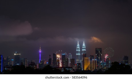 KUALA LUMPUR, MALAYSIA - JANUARY 1, 2017:  View of fireworks around KLCC and KL Tower on new year's eve in Kuala Lumpur, Malaysia. - Shutterstock ID 583564096