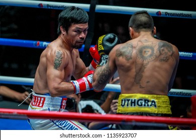 KUALA LUMPUR, MALAYSIA - JULY 15, 2018 : Philippines' Manny Pacquiao (L) Fights Argentina's Lucas Matthysse During Their World Welterweight Boxing Championship At Axiata Arena In Kuala Lumpur.