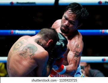 KUALA LUMPUR, MALAYSIA - JULY 15, 2018 : Philippines' Manny Pacquiao (R) Fights Argentina's Lucas Matthysse During Their World Welterweight Boxing Championship At Axiata Arena In Kuala Lumpur.