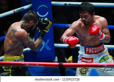 KUALA LUMPUR, MALAYSIA - JULY 15, 2018 : Philippines' Manny Pacquiao (R) Fights Argentina's Lucas Matthysse During Their World Welterweight Boxing Championship At Axiata Arena In Kuala Lumpur.