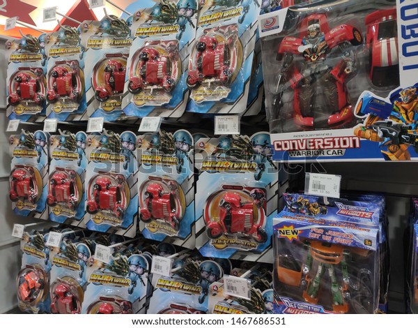 KUALA LUMPUR, MALAYSIA -JULY 22,\
2019: Children\'s toys are hung and exhibited to customers. Good\
design packaging. Sorted by type and labelled with a\
price.