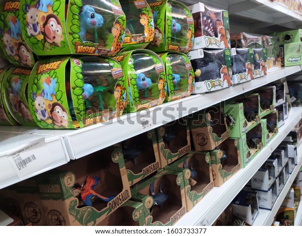 KUALA LUMPUR, MALAYSIA\
-JULY 22, 2019: Children\'s toys are placed on the rack and\
displayed to customers. Good design packaging. Sorted by type and\
labelled with a price.