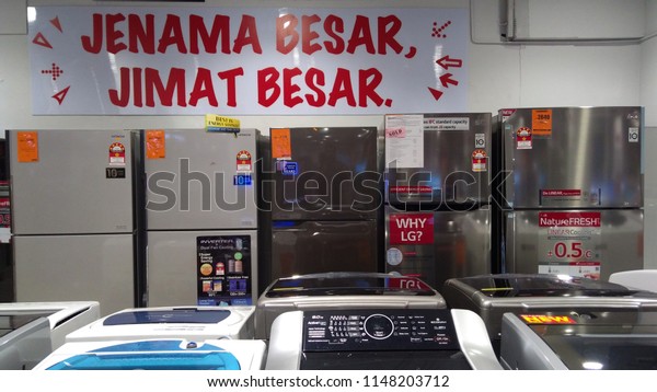 Kuala Lumpur,\
Malaysia - July 23, 2018 : Various brands of washing machine and\
fridge in the supermarket. \
