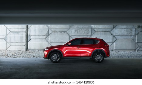 Kuala Lumpur, Malaysia - July 26, 2019: Mazda CX 5 side profile view. Modern crossover SUV parking in basement empty car park .