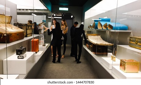 Kuala Lumpur / Malaysia - July 7, 2019: In The Louis Vuitton Time Capsule Exhibition Held In Suria KLCC Twin Tower. The Sales Associates Are Presenting The Luxury Items To The Visitors Professionally