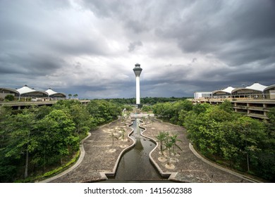 KUALA LUMPUR, MALAYSIA - JUN 2nd 2019: The View Of KLIA (Kuala Lumpur International Airport ) Tower Surrounded With Car Park Building And Dramatic Black Clouds.