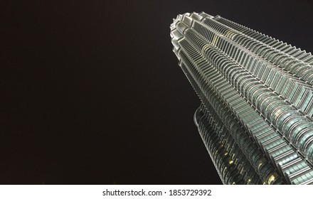 Kuala Lumpur, Malaysia - June 11, 2016: Looking Up To The KLCC Twin Towers At Different Angle At Night