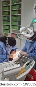 KUALA LUMPUR, MALAYSIA - JUNE 12, 2021 : Dentist Fillings Treatment Process For 9 Years Old Kids During Covid 19 Pandemic With All Staff And Doctor Wear Mask And Face Sheild