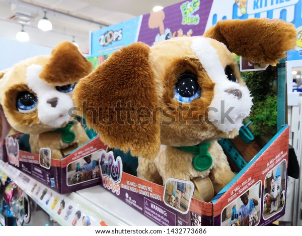 Kuala Lumpur ,\
Malaysia - June 2019 : Dog toy display at Toys R Us store.Toys\
\