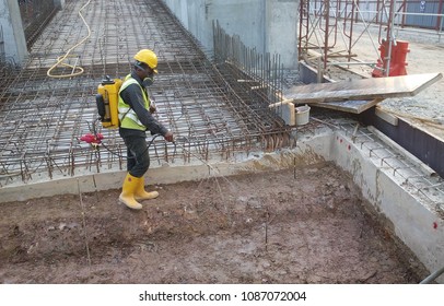 KUALA LUMPUR, MALAYSIA -JUNE 29, 2017: Construction Workers Spraying The Anti Termite Chemical Treatment To The Soil At The Construction Site. 