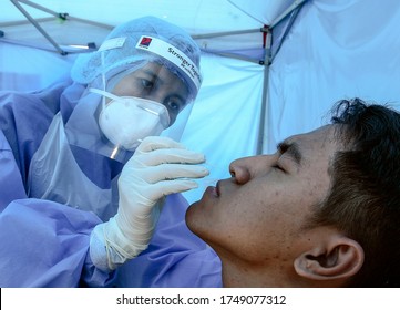 Kuala Lumpur, Malaysia : June 4, 2020 - Medical Team From Private Hospital Doing Screening Tests COVID 19 To Customer During Fight The Outbreak At Bangi. (selective Focusing)