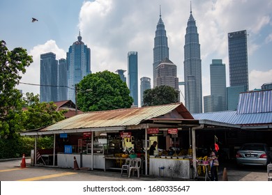 KUALA LUMPUR, MALAYSIA: MARCH, 2020: Petronas Towers from Kampung Baru, illustrating the juxtaposition between Kuala Lumpur's financial centre and the surrounding traditional residential areas