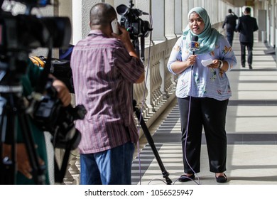 KUALA LUMPUR, MALAYSIA - MARCH 28, 2018. A Muslim Female Reporter Doing A Live Reporting At The Kuala Lumpur Court House In Kuala Lumpur, Malaysia.