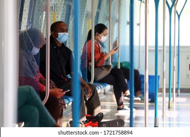 KUALA LUMPUR, MALAYSIA - MAY 04, 2020 : Public Service Users Wearing Face Mask In Mass Rapid Transit (MRT) During Conditional Movement Control Order In Covid-19 Situation.