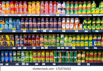 KUALA LUMPUR, MALAYSIA - MAY 04, 2020: Rows of variety canned food product on shelves in a grocery store supermarket. Canning is a method of preserving food in which the food contents are processed.