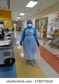 Kuala Lumpur, Malaysia- May 14 2020: A Healthcare Worker Is Wearing Personal Protection Equipment Before Examining Patients.