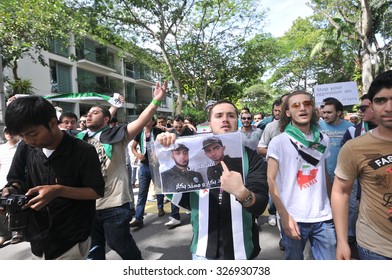 KUALA LUMPUR, MALAYSIA - MAY 31ST 2013: Unidentified Syrian and Malaysian people are marching and demonstrating against Bashar Assad in front of Syria Embassy in Kuala Lumpur, Malaysia.