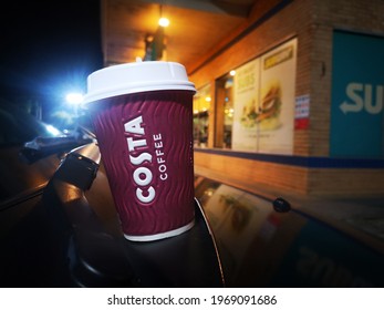 KUALA LUMPUR, MALAYSIA - MAY 6,2021 : A Cup Of Coffee Latte By Costa Coffee On A Boot Car. Night Shot. 