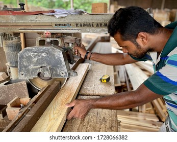 KUALA LUMPUR, MALAYSIA – May 8, 2020 : A Man Foreign Worker From Bangladesh Is Working At A Lumber Mill.