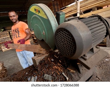 KUALA LUMPUR, MALAYSIA – May 8, 2020 : A Man Foreign Worker From Bangladesh Is Working At A Lumber Mill.