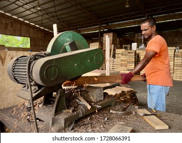 KUALA LUMPUR, MALAYSIA – May 8, 2020 : A Man Foreign Worker From Bangladesh Is Working At A Lumber Mill.