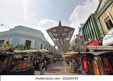 KUALA LUMPUR, MALAYSIA - MAY 9: Tourists In KL Central Market On May 9, 2012 In Kuala Lumpur, Malaysia. The Market Was Constructed In 1888 As A Wet Market And Refurbished Into A Cultural Bazaar.