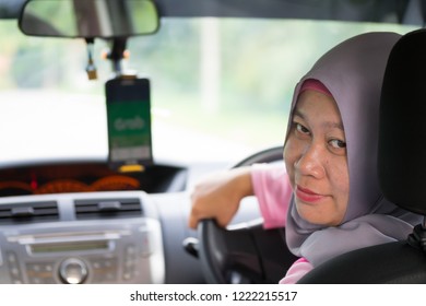 KUALA LUMPUR, MALAYSIA NOVEMBER 04 2018 : Asian Woman Driving Car To Travel Or Grab.
