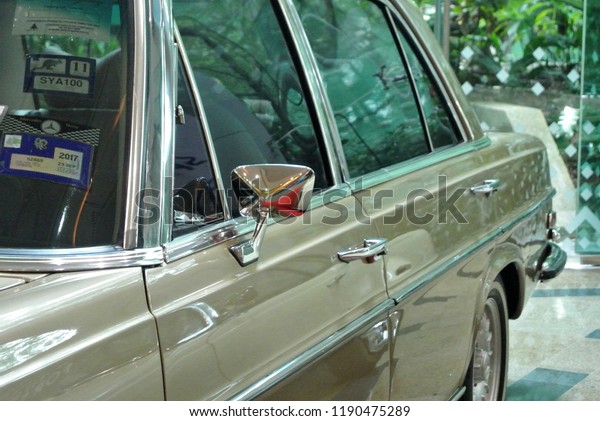 KUALA\
LUMPUR, MALAYSIA -NOVEMBER 12, 2017: Car side mirror or door mirror\
build at exterior of car for the purposes of helping the driver see\
areas behind and to the sides of the\
vehicle.