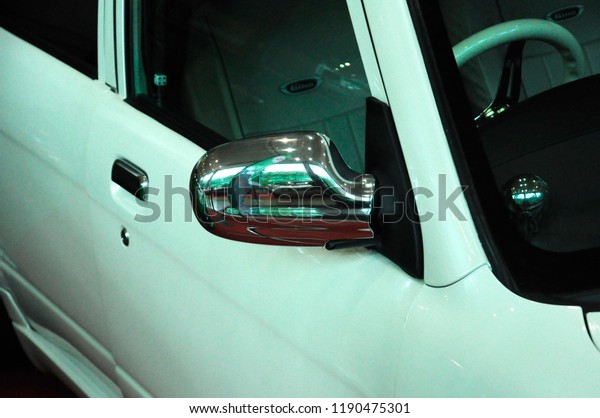KUALA
LUMPUR, MALAYSIA -NOVEMBER 12, 2017: Car side mirror or door mirror
build at exterior of car for the purposes of helping the driver see
areas behind and to the sides of the
vehicle.