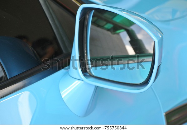 KUALA
LUMPUR, MALAYSIA -NOVEMBER 12, 2017: Car side mirror or door mirror
build at extrior of car for the purposes of helping the driver see
areas behind and to the sides of the
vehicle.