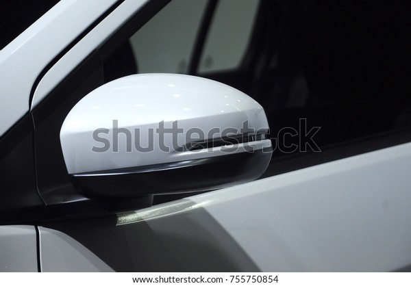 KUALA\
LUMPUR, MALAYSIA -NOVEMBER 12, 2017: Car side mirror or door mirror\
build at extrior of car for the purposes of helping the driver see\
areas behind and to the sides of the vehicle.\
\
