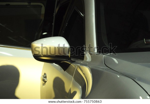 KUALA\
LUMPUR, MALAYSIA -NOVEMBER 12, 2017: Car side mirror or door mirror\
build at extrior of car for the purposes of helping the driver see\
areas behind and to the sides of the vehicle.\
\
