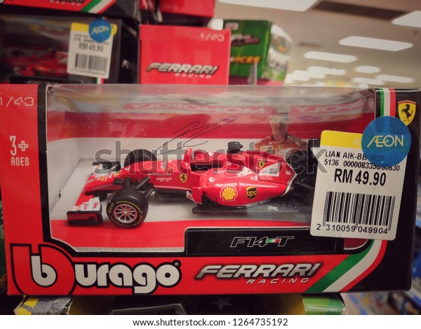 Kuala\
Lumpur, Malaysia - November 2018 : Ferrari Formula One diecast made\
by burago display for sale in toy store.Ferrari is an Italian\
luxury sports car manufacturer based in\
Maranello