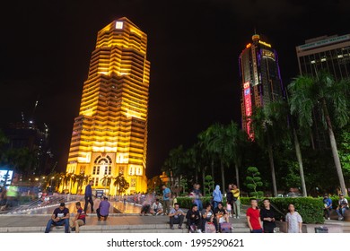 Kuala Lumpur, Malaysia - November 28, 2019: Night street view of Kuala Lumpur downtown with the Public Bank building