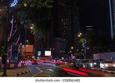 Kuala Lumpur, Malaysia - November 28, 2019: Kuala Lumpur Night Street View With Blurred Cars And Ordinary People