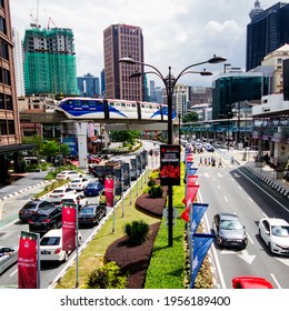 Kuala Lumpur Malaysia November 30 2019. Sky Train Above The Busy Street In Kuala Lumpur. Many Cars On The Street During Daytime. Colorful City In Asia. Street Life In The Capital City Of Malaysia.