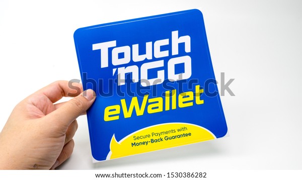 Kuala Lumpur,\
MALAYSIA - Oct 2, 2019:  Holding Touch ‘n Go or TnG eWallet\
sticker. Touch ‘n Go eWallet is an integrated mobile app to use the\
physical Touch ‘n Go Card in\
Malaysia.