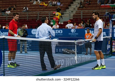 KUALA LUMPUR, MALAYSIA - OCTOBER 01, 2015: Mischa Zverev (red) And Feliciano Lopez Waits For The Coin Toss To Start Their Match At The Malaysian Open 2015 Tennis Tournament Held At The Putra Stadium.