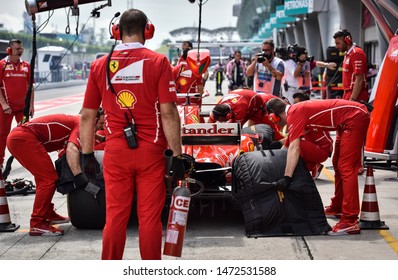 KUALA LUMPUR, MALAYSIA - OCTOBER 1, 2017 : Sebastian Vettel (Germany) Making A Pitstop In The Scuderia Ferrari SF71H F1 2018 Car During The F1 At Sepang Circuit.